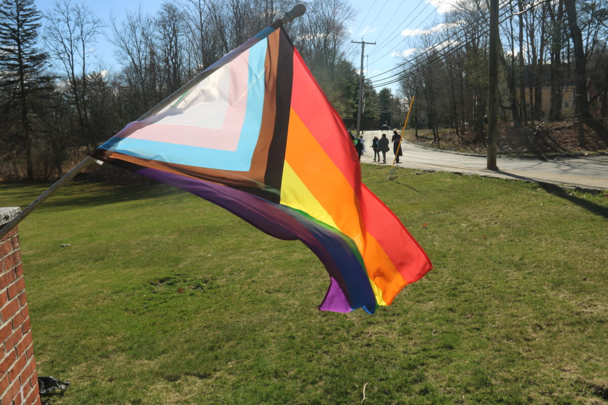 Progressive pride flag in front of HTLC.