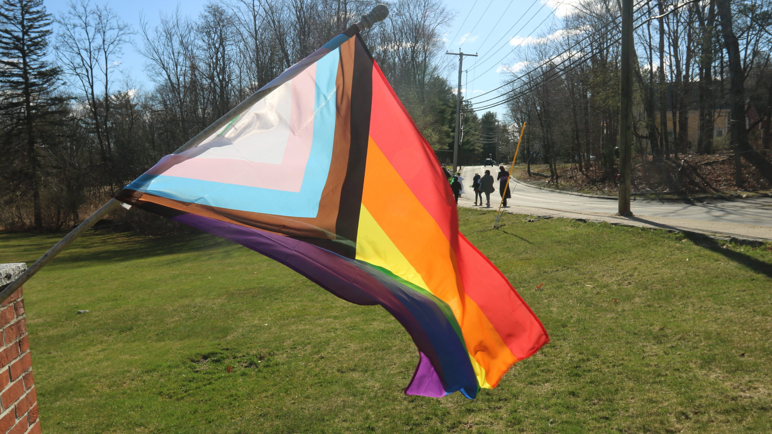 Progressive pride flag in front of HTLC.